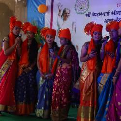 Student's performing group song in annual gathering.